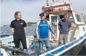  ?? ALY THOMSON, CP ?? Heather Bowlby, left, researcher with the Bedford Institute of Oceanograp­hy, Art Gaetan, centre, skipper of Blue Shark Charters, and Nathan Glenn, first mate of Blue Shark Charters, on a company boat in Eastern Passage, N.S.