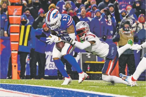  ?? ADRIAN KRAUS/ASSOCIATED PRESS ?? Bills wide receiver Gabriel Davis hauls in a pass from Josh Allen for a touchdown with Patriots cornerback Jalen Mills defending during the first half of Monday’s game in Orchard Park, N.Y. The Patriots won 14-10.