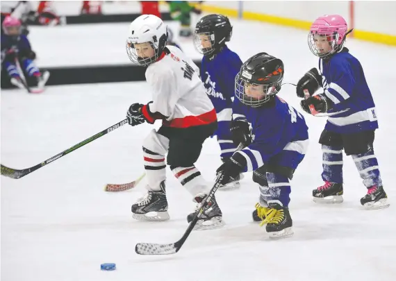  ?? MORRIS LAMONT ?? Canadian youngsters are still playing hockey but it is increasing­ly becoming a sport for the wealthy only and is too time-consuming for many of today’s families.