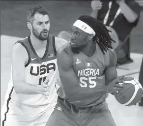  ?? ETHAN MILLER/GETTY IMAGES ?? Precious Achiuwa (55) of Nigeria is guarded by Kevin Love of the United States during an exhibition game ahead of the Tokyo Olympic Games on Saturday in Las Vegas, Nev.