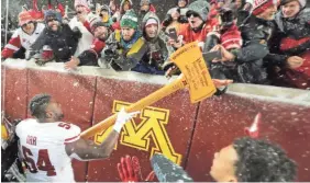  ?? / MILWAUKEE JOURNAL SENTINEL ?? Wisconsin reclaimed Paul Bunyan's Axe last season in Minnesota.