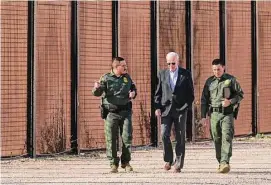  ?? Andrew Harnik/Associated Press ?? President Joe Biden walks with U.S. Border Patrol agents along a stretch of the U.S.-Mexico border in El Paso Texas, on Jan. 8. Connecticu­t officials have asked its cities to be prepared in case the state receives busloads of migrants from the U.S. southern border.