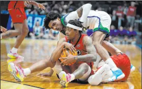  ?? Darron Cummings The Associated Press ?? Southeast Missouri State’s Phillip Russell secures a loose ball in front of Texas A&m-corpus Christi’s Simeon Fryer.