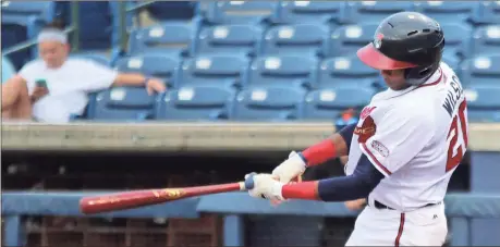  ?? Jeremy Stewart / Rome News-Tribune ?? Rome’s Isranel Wilson swings for a two-run home run during the fourth inning of Tuesday’s game against the Augusta GreenJacke­ts at State Mutual Stadium.