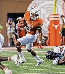  ?? Ronald Cortes/Contributo­r ?? Roschon Johnson spent his career at Texas in Bijan Robinson’s shadow, but he has the size and speed to be a productive NFL back.