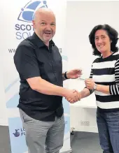  ??  ?? Award Jane was named Scottish Squash Coach of the Year in 2019. She received her award from Scottish Squash president Mark Adderley