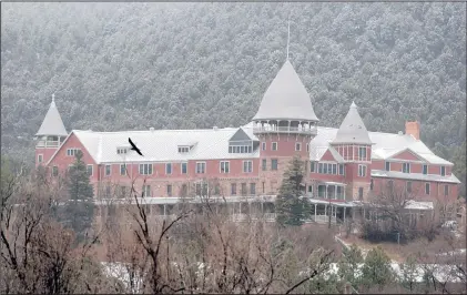  ?? EDDIE MOORE/JOURNAL ?? Snowfall hits Montezuma Castle, home of the United World College and a former Harvey House resort, near Las Vegas, N.M., in February. The school is opening its campus for public tours as area leaders try to bring more visitors to the Las Vegas area to...