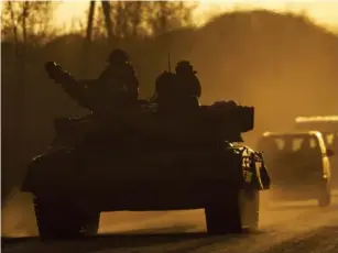  ?? ?? Ukrainian forces on their way to the frontline near Bakhmut (Anado l u Agency/Getty)