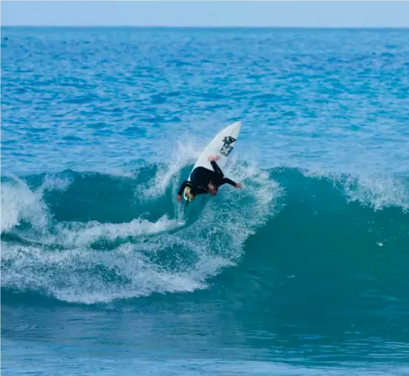  ??  ?? Already sporting a mature power base, Harrison drives one vert just up the coast from home. Photo: Warren Hawke.