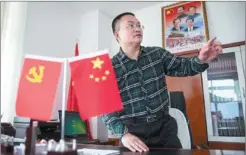  ?? KUANG LINHUA / CHINA DAILY ?? Liu Gesheng at his office in Medog county town.