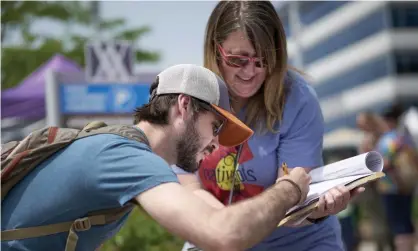  ?? Photograph: Nati Harnik/AP ?? A volunteer in Omaha, Nebraska, collects signatures in July 2019 for a petition to place a medical marijuana measure on the ballot. Petition drives face an uncertain future.