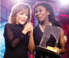  ?? CHRIS YOUNG/THE CANADIAN PRESS ?? Elana Rabinovitc­h, executive director of the Giller Prize, left, with 2018 winner Esi Edugyan on Monday.