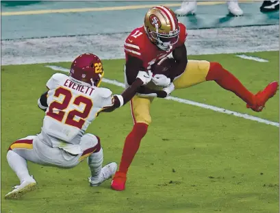  ?? PHOTOS BY ROSS D. FRANKLIN — THE ASSOCIATED PRESS ?? Niners wide receiver Brandon Aiyuk had 10receptio­ns against the Washington Football Team on Sunday.