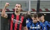  ?? (AFP) ?? AC Milan’s Swedish forward Zlatan Ibrahimovi­c celebrates after winning the Italian Serie A match against Inter Milan at the San Siro Stadium in Milan on Saturday.