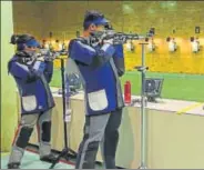  ??  ?? Shooters practice ahead of the World Cup that begins today at the Karni Singh Ranges. HT PHOTO
