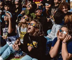 ?? Josie Norris/staff file photo ?? A group of students from the Space Engineerin­g Technologi­es Academy at Krueger Middle School cheer as they watch the annular eclipse last Oct. 14 at Louise Hays Park in Kerrville.