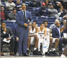  ?? Jessica Hill / Associated Press ?? UConn coach Kevin Ollie calls out to his players during the first half against Central Florida on Wednesday in Storrs.