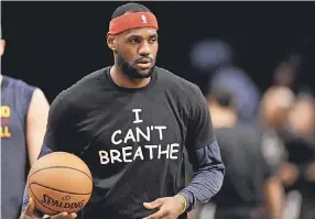  ??  ?? LeBron James wore “I Can’t Breathe” during a 2014 warm- up after a grand jury ruling not to indict an officer in the death of a N. Y. man. FRANK FRANKLIN II/ AP