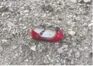  ?? BORNA GHASSEMI/ISNA/AFP VIA GETTY IMAGES ?? A child’s shoe at the site of the Ukrainian airliner’s crash.