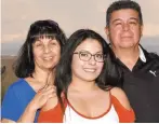  ?? COURTESY PHOTO ?? Marisa-Ann Lopez of Santa Fe, center, who is studying culinary arts at Santa Fe Community College, is the first recipient of a $1,500 Abiquiú Land Grant-Georgia O’Keeffe Museum Scholarshi­p offered in partnershi­p with the LANL Foundation. Shown with her are her parents, Kathy and Francis Lopez.