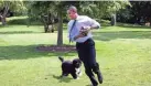  ?? IMAGES ?? Then-President Barack Obama is chased by the family dog, Bo, on the South Lawn of the White House in May 2009. PETE SOUZA/THE WHITE HOUSE VIA GETTY