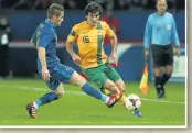  ?? Photo: David Rogers/Getty Images ?? BIG LOSS: Mile Jedinak in action in the 6-0 defeat by France in 2013 in Paris.