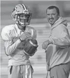  ?? ADAM CAIRNS/THE COLUMBUS DISPATCH ?? West Jefferson QB Tyler Buescher and his father, coach Shawn Buescher, await a rematch with Coldwater.