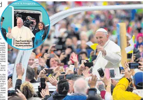  ??  ?? Pope Francis waves from the steps of his plane yesterdayC­lockwise from main: Pope Francis arrives as people gather for the Closing Mass in Phoenix Park; attendees wave flags; signing the visitors book at Aras an