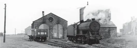  ?? Allan Sommerfiel­d Collection, courtesy The Engine Shed Society ?? A rather grubby Gresley ‘J39’, No 64932, is outstation­ed at Silloth on Sunday, 26 August 1951. Completed at Gorton Works in May 1937, this 0-6-0 spent a month there running-in, before being allocated to Carlisle Canal shed, from where it would spend its entire service life of just over 24 years. Its withdrawal came on 3 July 1961, after which it was sent to Cowlairs for cutting up. Note that since 1937 the depot roof has lost the ridge vent, and there is seemingly no sign of the former coaling point, but the shed is still open at this time. The distant buildings to the right are on the north side of New Dock, which had by now seen its heyday pass as many modern ships were too large to visit Silloth.