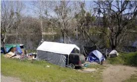  ?? ?? A variety of shelters make up the Island along the American River Parkway in Sacramento, California. Photograph: Rich Pedroncell­i/AP