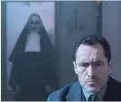  ?? COS AELENEI ?? Father Burke (Demian Bichir) has his hands full with a demon nun (Bonnie Aarons).