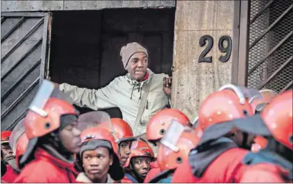  ??  ?? Bedevilled: A security service company hired by the City of Johannesbu­rg this month evicted residents of Newtown (above). People evicted from a building in central Johannesbu­rg’s Maboneng district camp out under the M2 motorway (below).