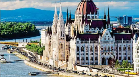  ??  ?? Gothic beauty: The Hungarian parliament building on the Pest side of the river Danube