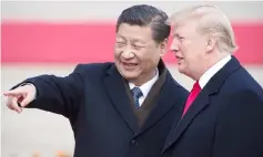  ??  ?? Xi (left) and Trump attend a welcome ceremony at the Great Hall of the People in Beijing, in this file picture. — AFP photo