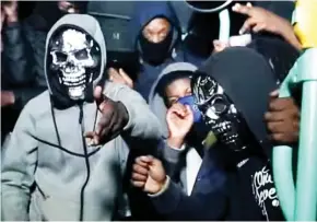 ??  ?? Hooded and masked: The Tottenham/Park Lane Boys’ video