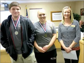 ?? Photo by Susan Holland ?? Gravette HOSA club president-elect Hunter Graham, club president Jaye Chalk and their sponsor, Robin Hilger, attended a recent Gravette school board meeting and reported on their trip to state competitio­n. Hunter is wearing the silver medal he earned...