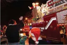  ?? PHOTO PROVIDED ?? Santa rides a fire truck in the annual Ballston Spa Holiday Parade.