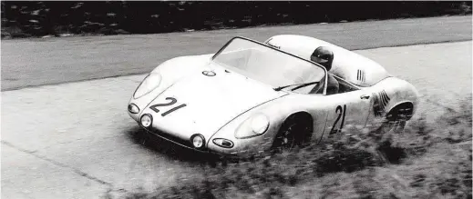  ??  ?? Below: In the Nürburgrin­g 1000 Kilometres of 1961 Dan drives a Porsche type 718. He is seen here in the famous Karussell