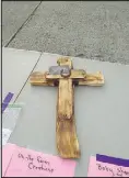  ?? COURTESY PhOTO ?? Those who came to the bake sale and silent auction on Sunday in Noel had a chance to bid on several items, such as this cross. Funds went to help the families of two heroes that helped during a recent fire.