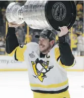  ?? THE CANADIAN PRESS/ FILES ?? Canada’s Sidney Crosby celebrates after Pittsburgh won the Stanley Cup.