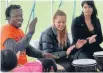  ??  ?? Festive fun: Summerz End Youth Festival at Jellie Park. Traditiona­l African drumming was taught by Robert Fugah with Rythm Heke, centre, and June Dahlia, from Purapura Whetu Maori Youth group, giving it a go.