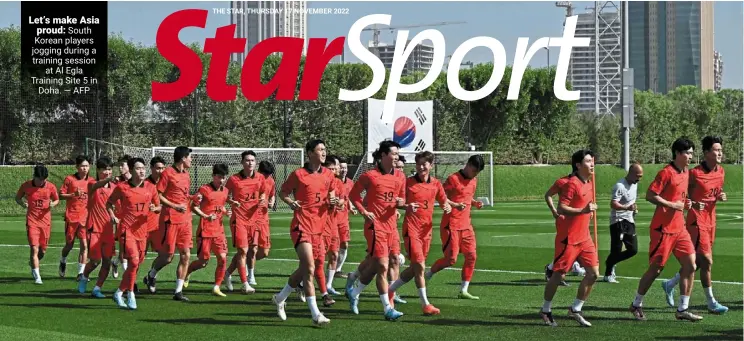  ?? — AFP ?? Let’s make Asia proud: South Korean players jogging during a training session at Al Egla Training Site 5 in Doha.