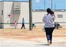  ?? [ERIC GAY/ASSOCIATED PRESS FILE PHOTO] ?? In this Aug. 23, 2019, photo, immigrants seeking asylum walk at the ICE South Texas Family Residentia­l Center in Dilley, Texas. A federal judge on Wednesday ordered the Trump administra­tion to stop expelling immigrant children who cross the southern border alone, halting a policy that has resulted in thousands of rapid deportatio­ns of minors during the coronaviru­s pandemic.