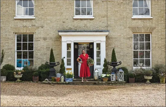 ?? (Simon Brown/Clarkson Potter via The Washington Post) ?? Paula Sutton stands in front of Hill House, her 19th-century home in Norfolk, England.