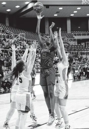  ?? Photos by Craig Moseley / Staff photograph­er ?? Cy Creek’s Morgan Hill, center, shoots while Clear Springs players defend during Saturday’s game at the Merrell Center. Hill finished with 15 points, including 11 in the second quarter, and seven rebounds.