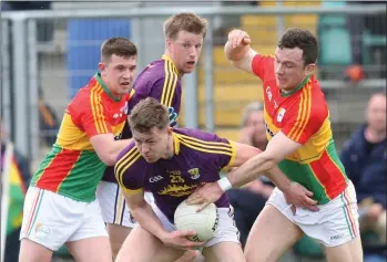  ??  ?? Naomhan Rossiter on the ball with his brother, Tiarnan, ready to offer support if required.