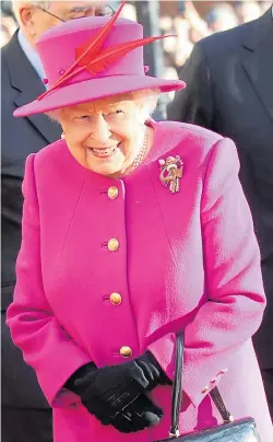  ??  ?? The Queen looked resplenden­t in her matching outfit yesterday