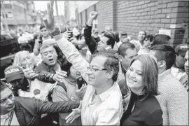  ?? Ivan Valencia EPA/Shuttersto­ck ?? COLOMBIAN presidenti­al candidate and former Bogota Mayor Gustavo Petro, shown arriving to vote in Bogota, scored big in Sunday’s primary elections.