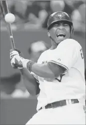  ?? Getty Images ?? EDWIN ENCARNACIO­N REACTS after being hit by a pitch from Ervin Santana in the fifth inning.