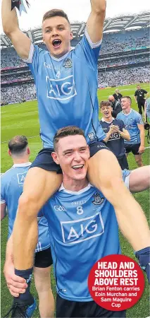  ??  ?? HEAD AND SHOULDERS ABOVE REST Brian Fenton carries Eoin Murchan and Sam Maguire Cup